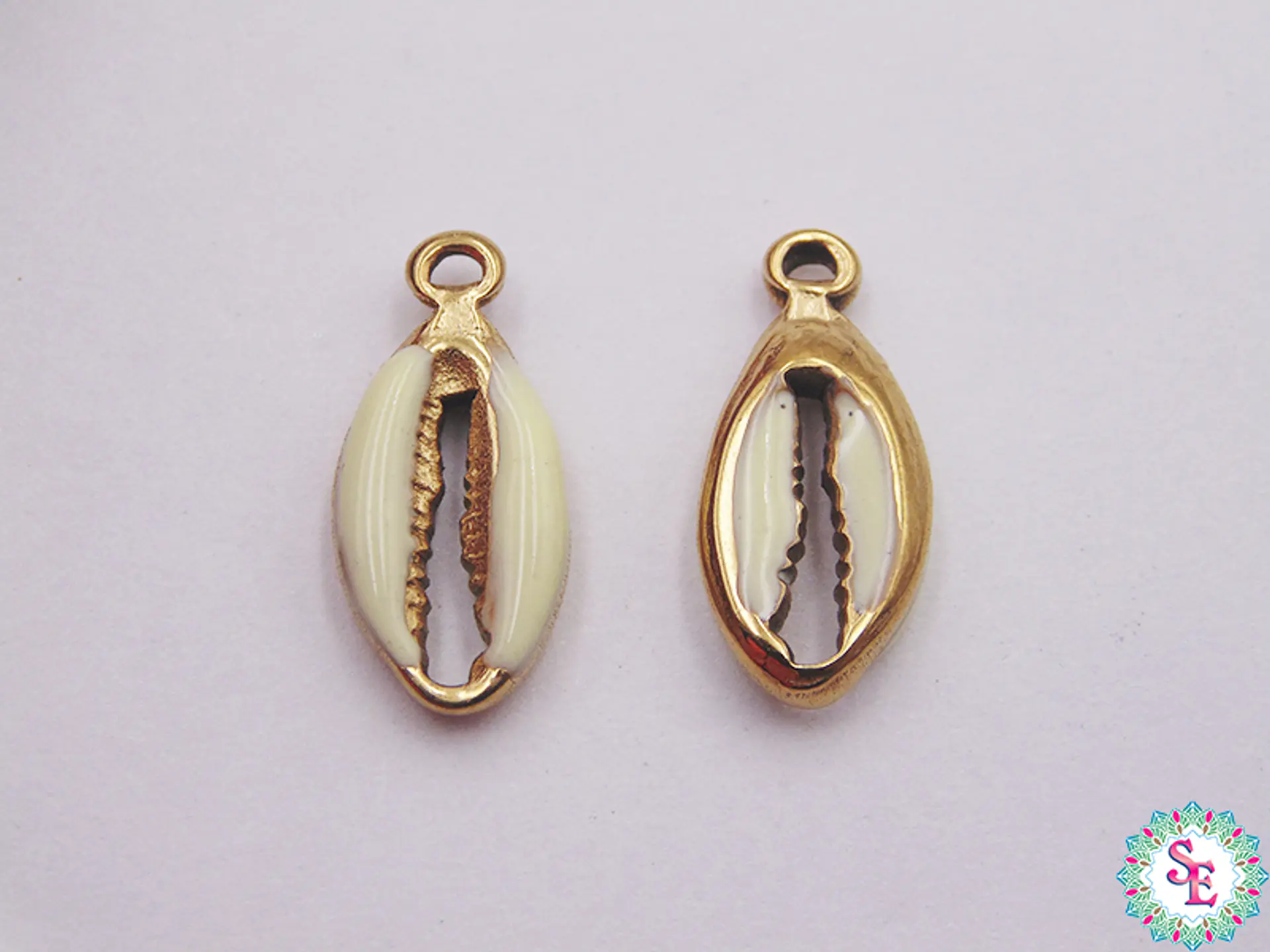 ACERO DORADO DIJE CONCHA RESINA BEIS 17*8MM  1