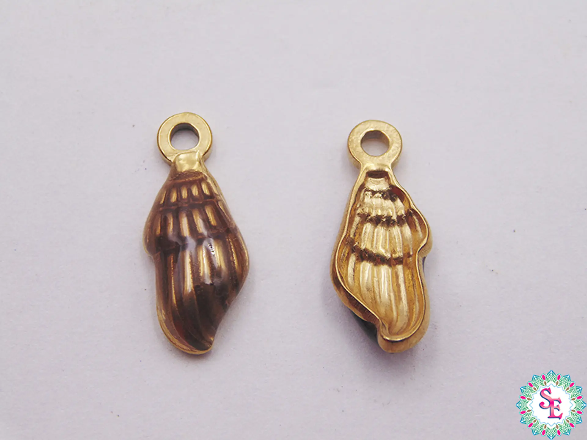 ACERO DORADO DIJE CARACOL RESINA CAFE 18*8MM  1