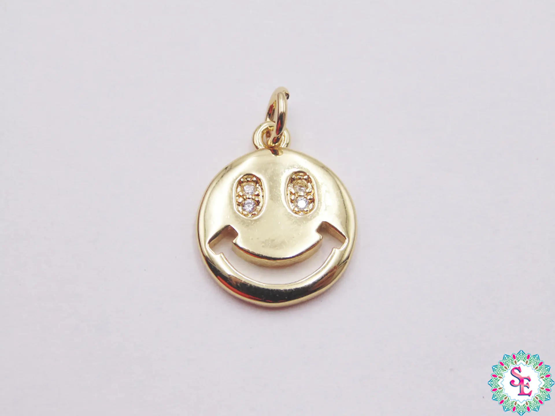 RODIO DORADO DIJE CARA FELIZ 572D OJO CIRCON 10MM 1