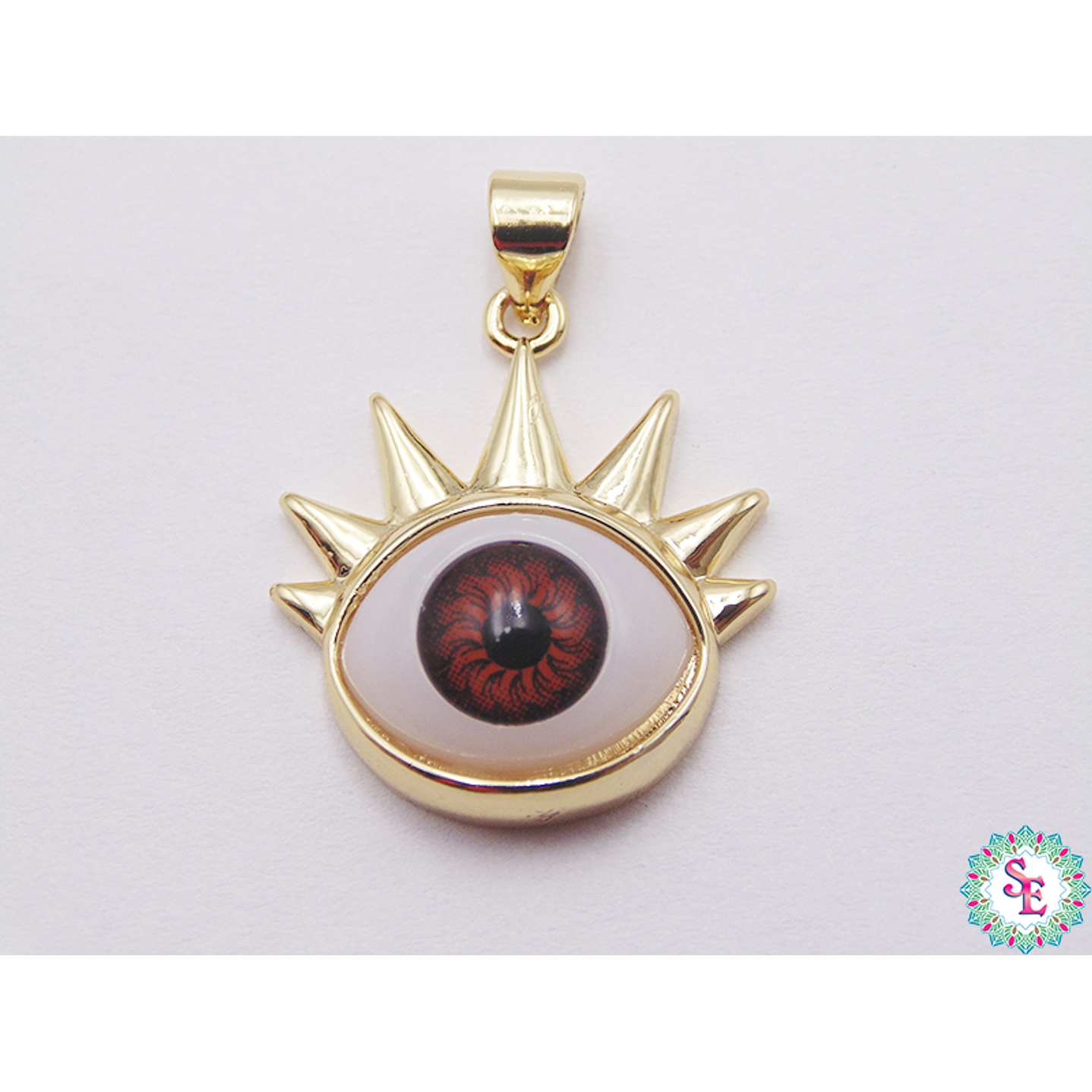 RODIO DORADO DIJE OJO CAFE PESTAÑA 21MM 1