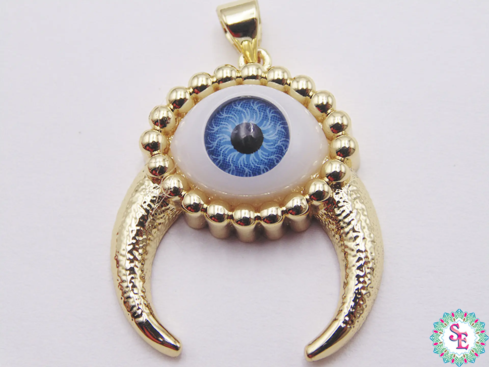 RODIO DORADO DIJE OJO AZUL CLARO CACHOS 26MM 1