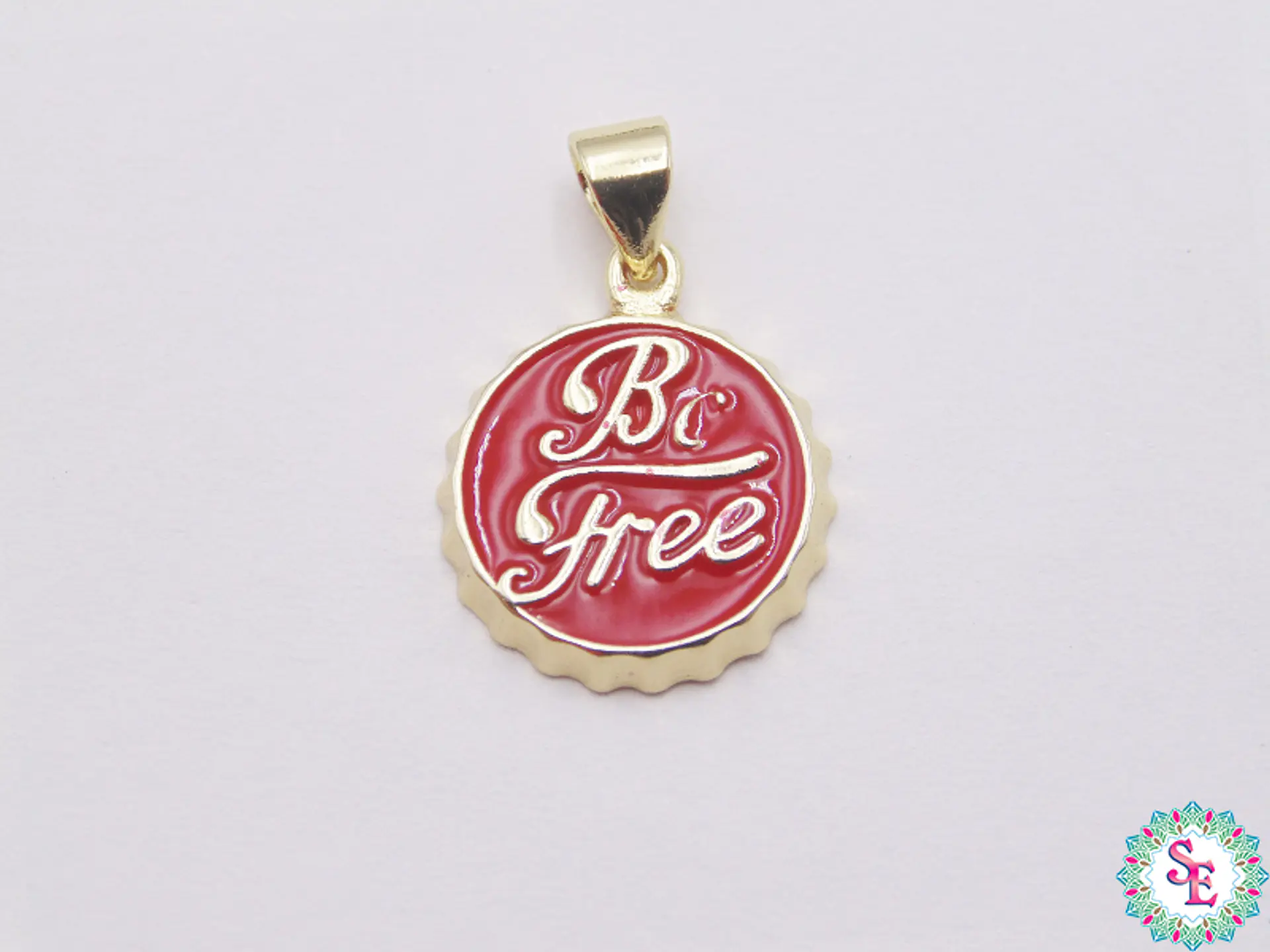 RODIO DORADO DIJE TAPA ROJA BE FREE (SE LIBRE)  1