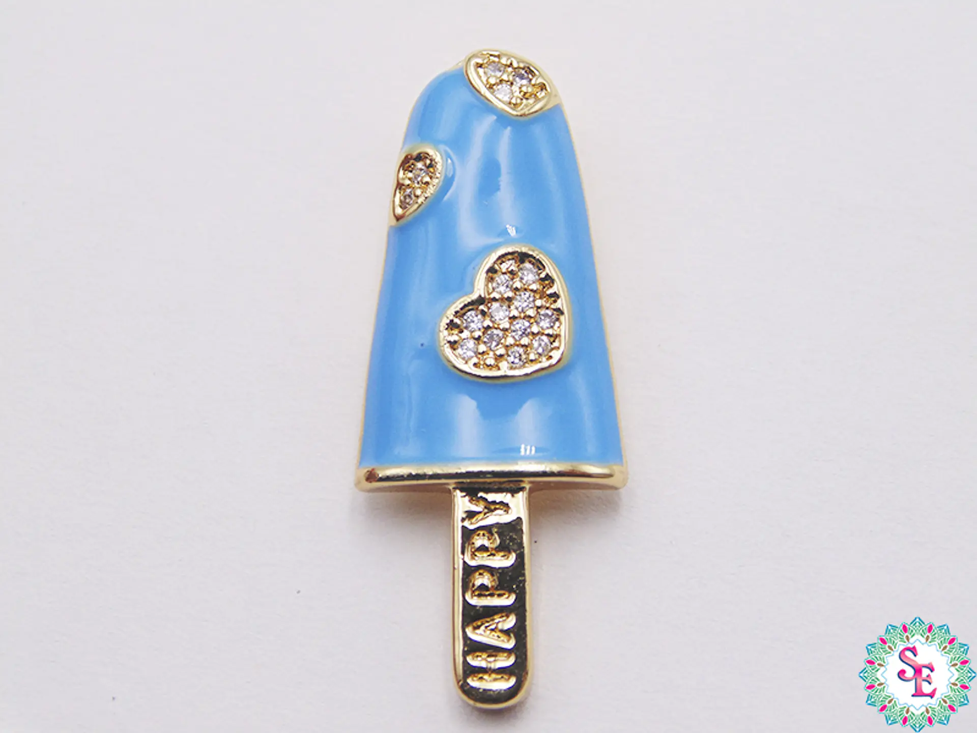 RODIO DORADO DIJE PALETA AZUL CLARO CORAZON CIRCON 30MM  1