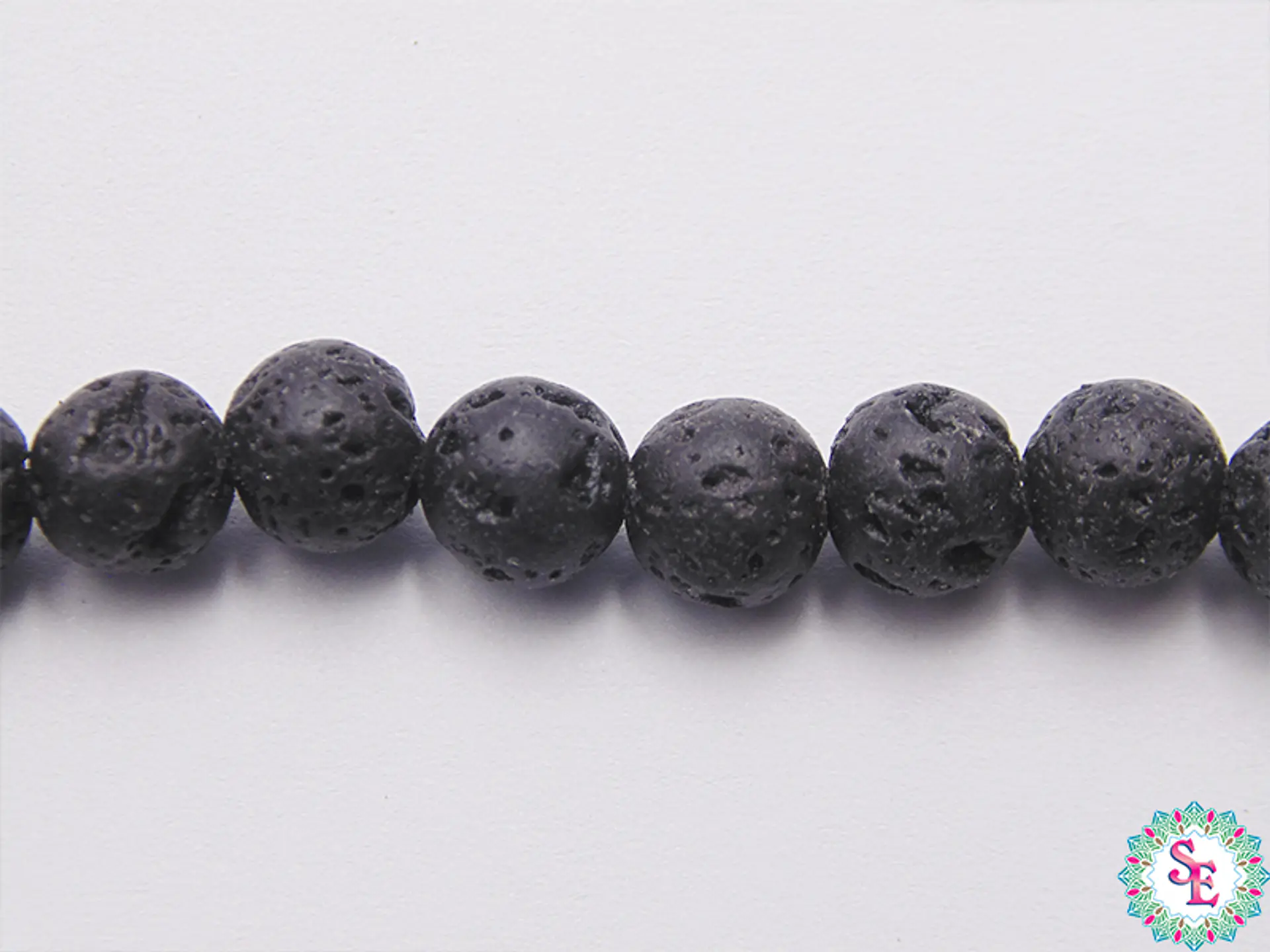 SARTA DE PIEDRA 6MM  VOLCANICA NEGRA  X64 UND APROX. 1