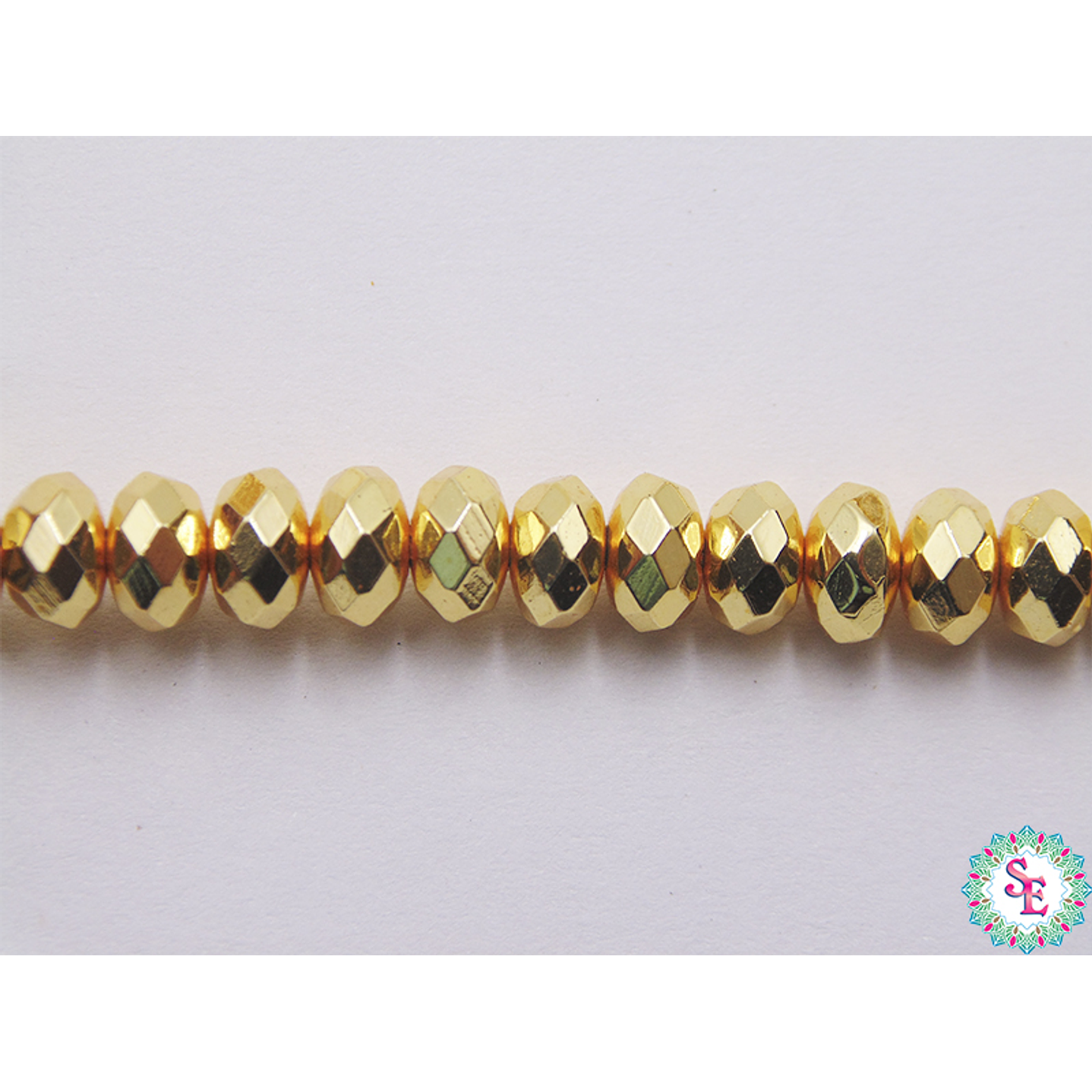 ACERINA DORADA 42 RONDELA FACETADA 4*6M X 181 UND APROX  1