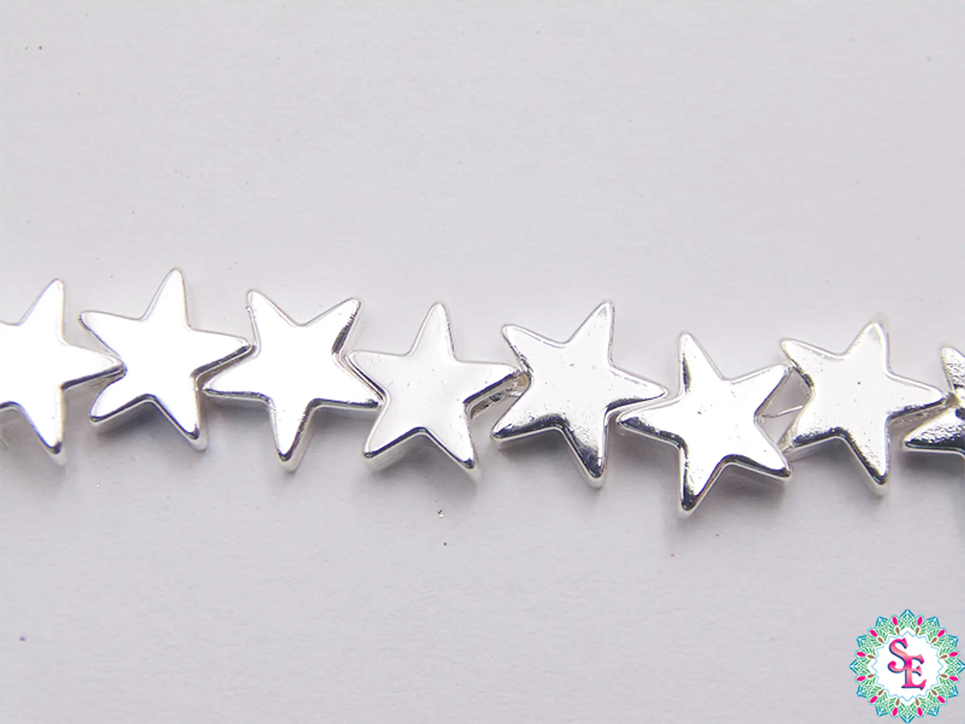 ACERINA PLATEADA 33 ESTRELLA 8MM X 32 UND APROX  1
