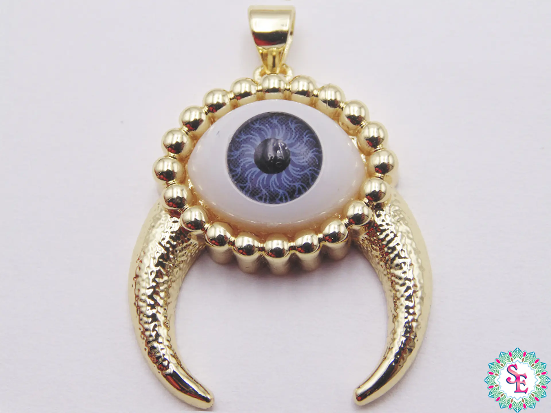 RODIO DORADO DIJE OJO GRIS CACHOS 1