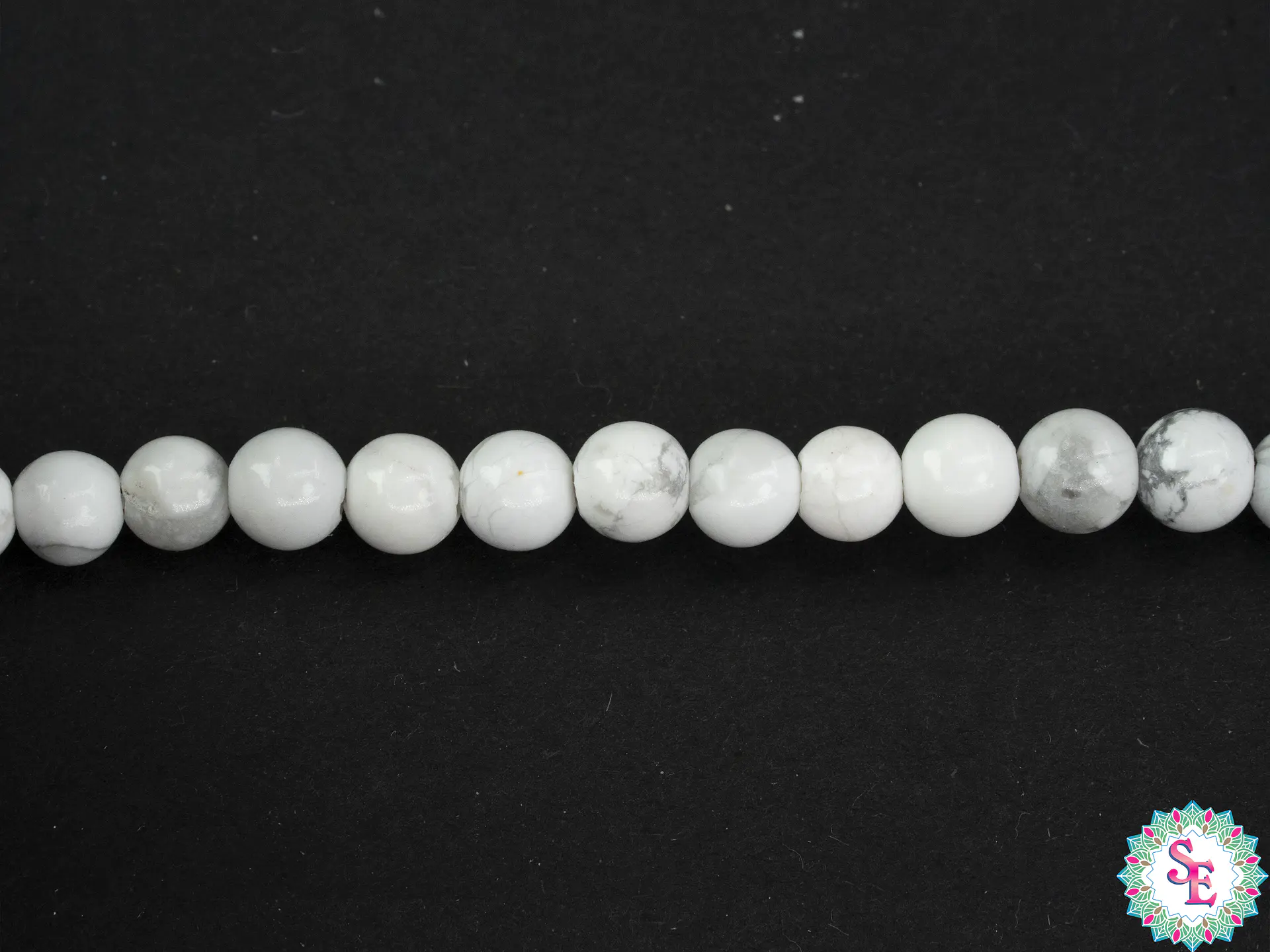 SARTA DE PIEDRA NATURAL LISA 4MM HOWLITA  1