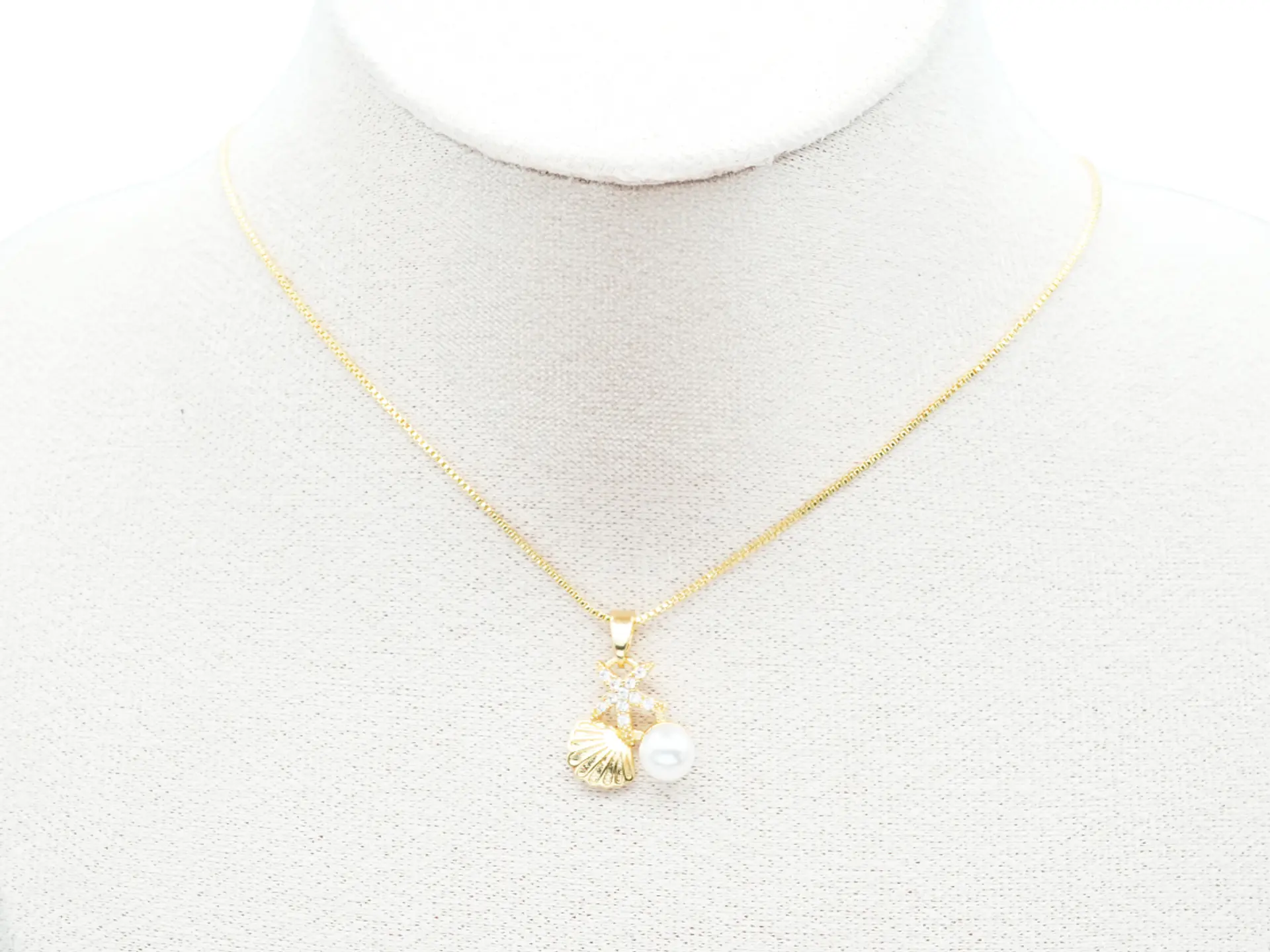 RODIO DORADO DIJE PERLA CONCHA ESTRELLA MAR ZIRCON 14MM 2