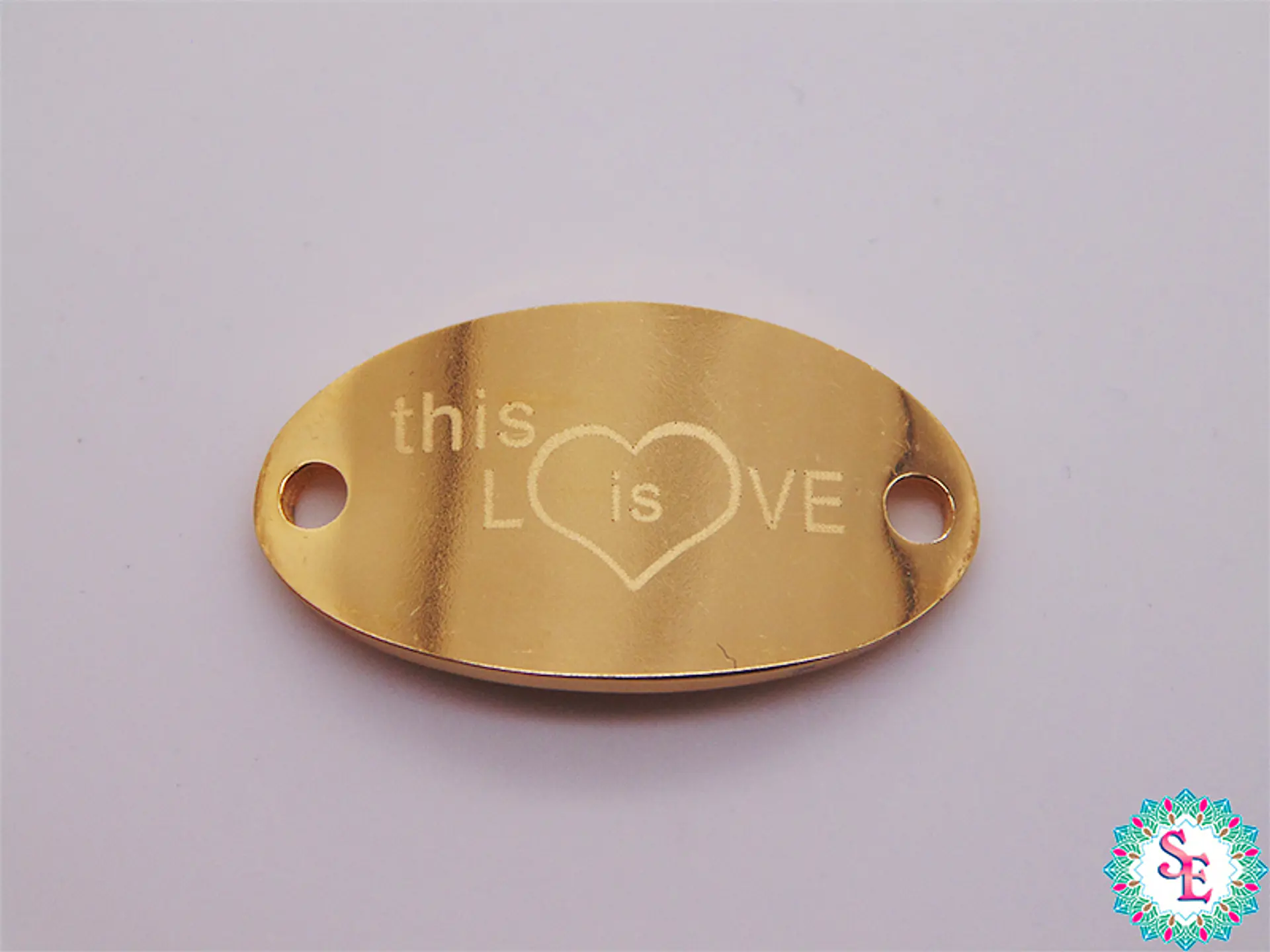 ACERO DORADO PLACA THIS IS LOVE 22*13MM  1