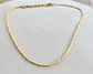 Collar bañado en oro con Mostacillas. - Miniatura 2