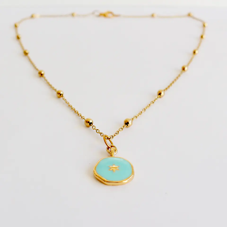 Collar bañado en oro con Dije Calipso. 3