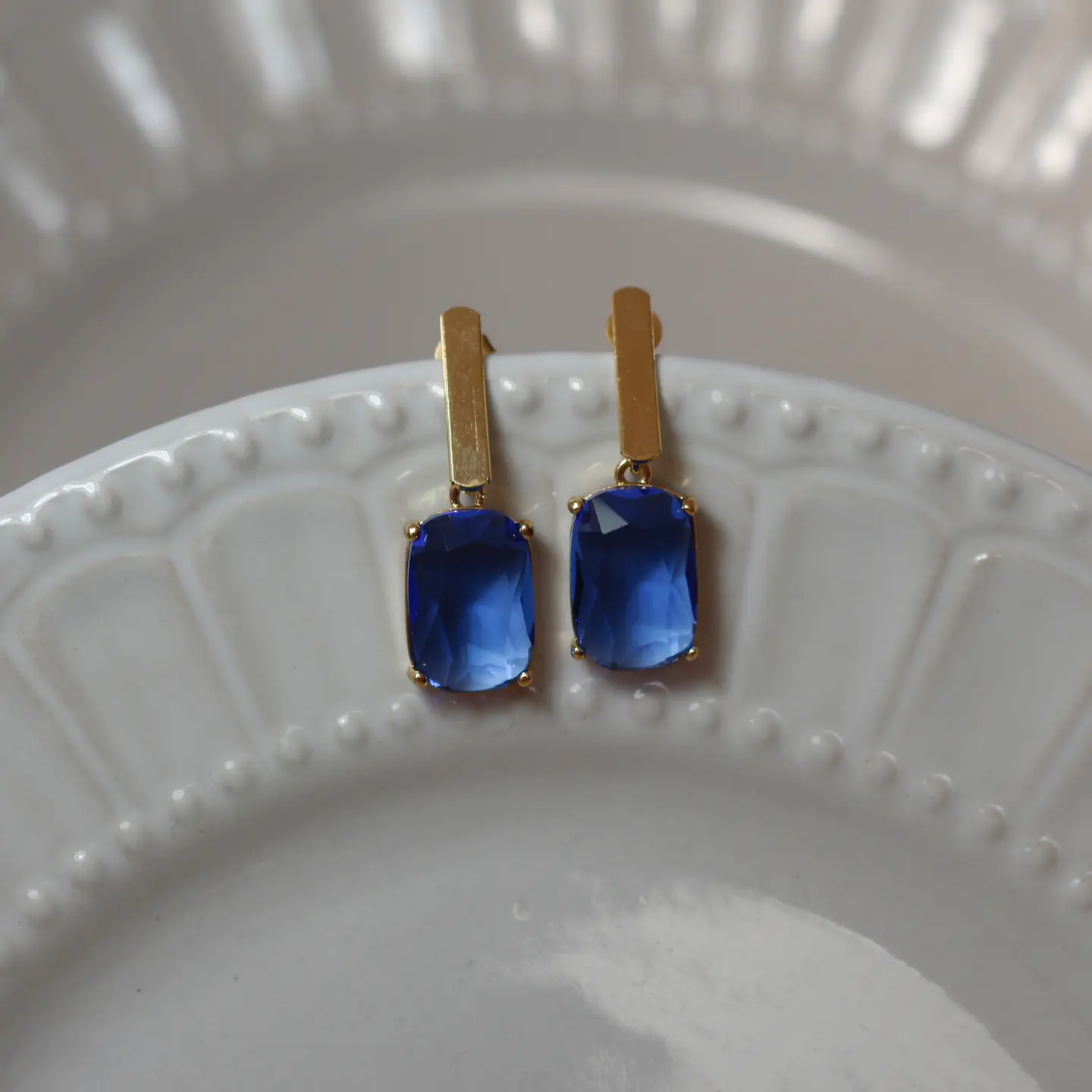 Aros bañados en oro con Cristal azul. 2