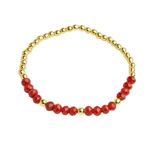 Pulsera elástica con balines enchapados en oro y cristales rojos