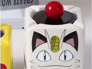 Cenicero Meowth