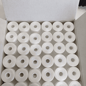 Carrete con hilo 75d/2  120 mts. caja 144 unidades