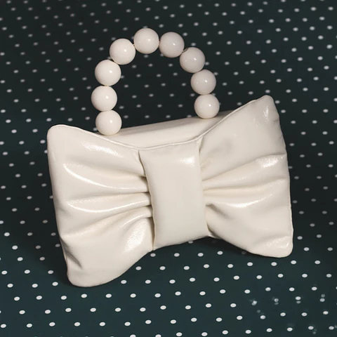 NAILA BEADED BOW BAG HUESO