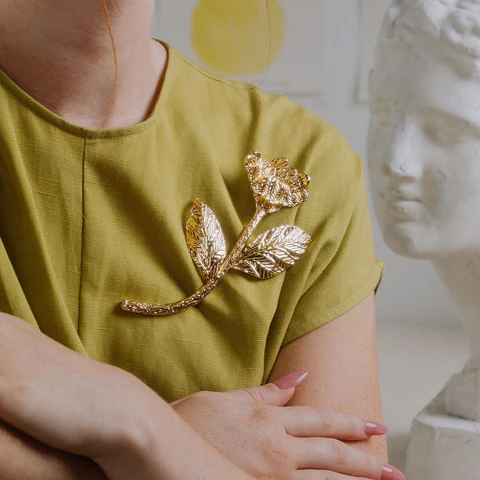 PRENDEDOR POPPY ORO
