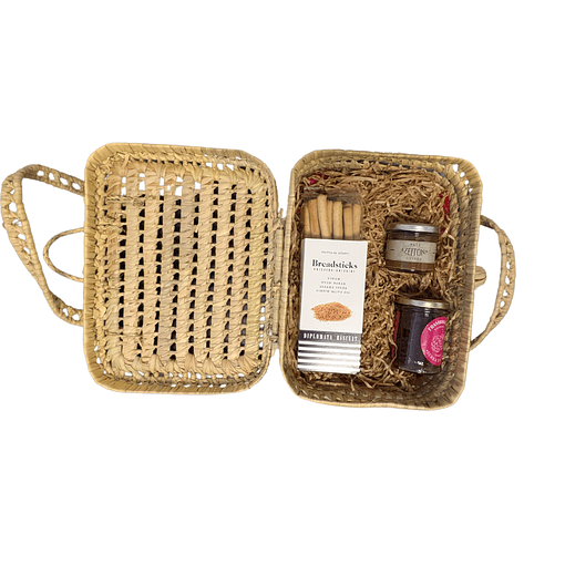 Hamper in a handmade basket with jam, olive pâté and biscuits