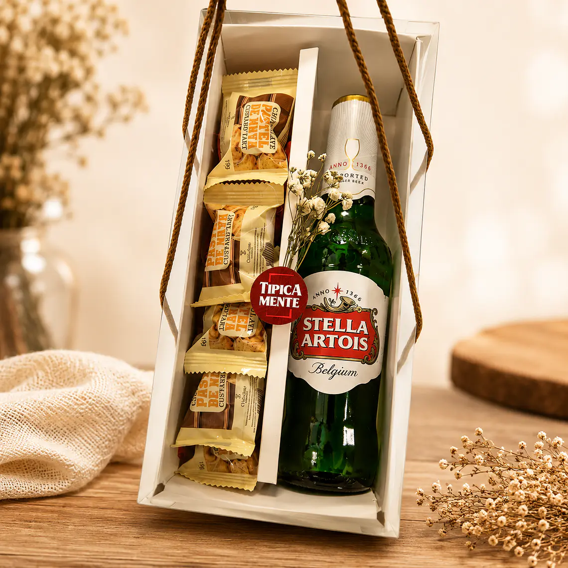 Gourmet box with handles containing a drink and chocolate. 2