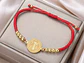 Pulsera Medalla San Benito Hilo Rojo y Acero Dorado - Miniatura 4