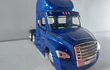 Mula Freightliner Cascadia cama baja y tractor 1/43 azul, new ray