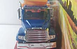 Volqueta Freightliner 114SD azul, New Ray, 1-32