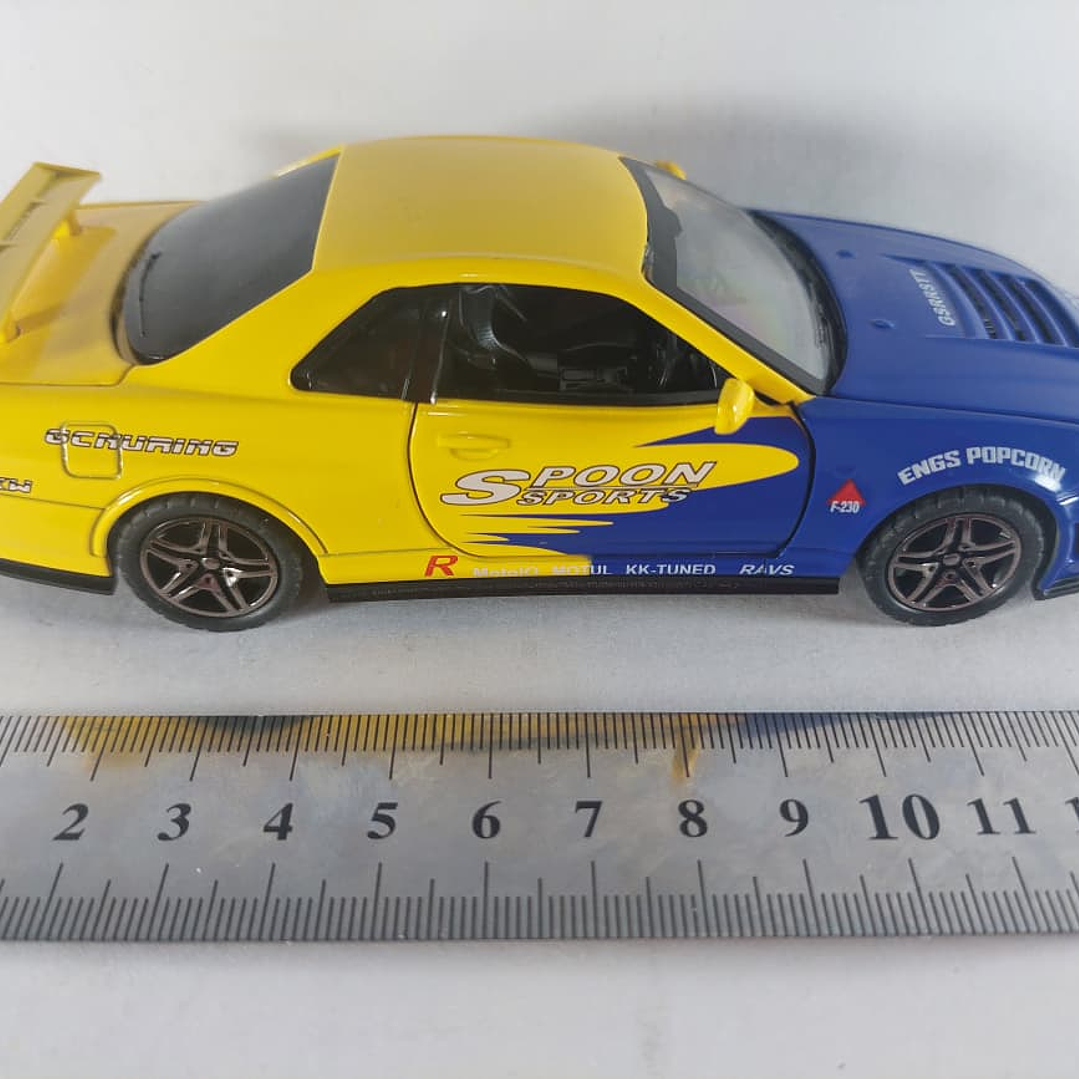 Nissan Skyline GT-R AZUL Y AMARILLO Escala 1-32 LEDS 4