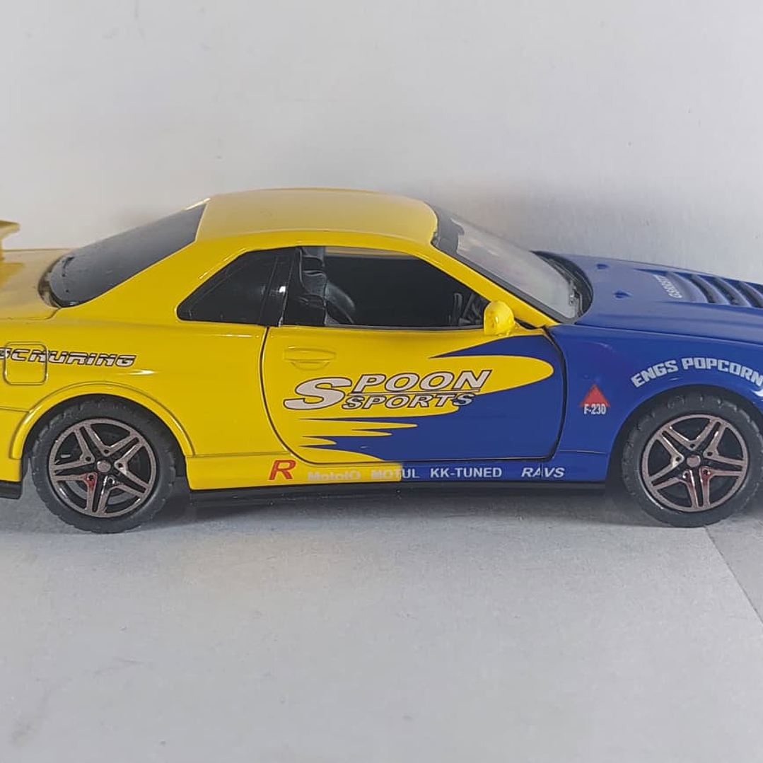 Nissan Skyline GT-R AZUL Y AMARILLO Escala 1-32 LEDS 8