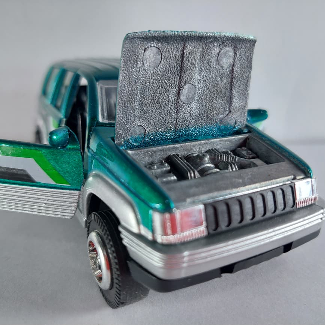 Jeep Cherokee verde ,Escala 1/36 marca china  6