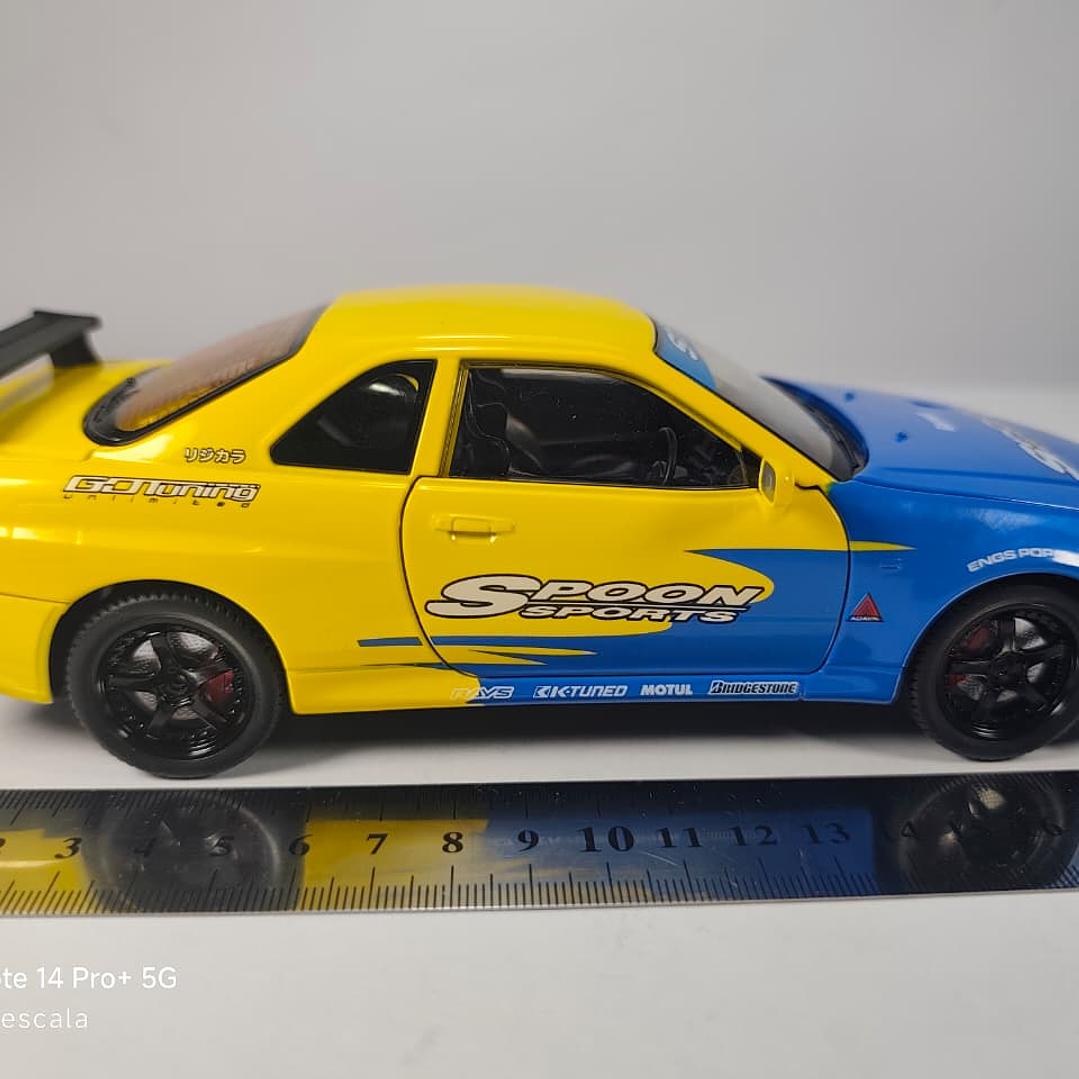 Nissan Skyline Gtr  ESCALA 1:24 MARCA JINLIFANG, AMARILLO  8