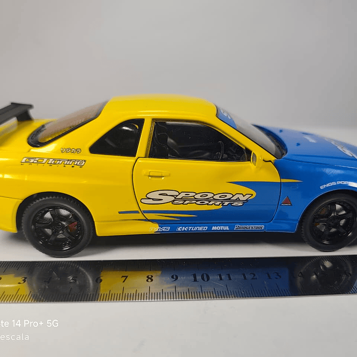 Nissan Skyline Gtr  ESCALA 1:24 MARCA JINLIFANG, AMARILLO  8