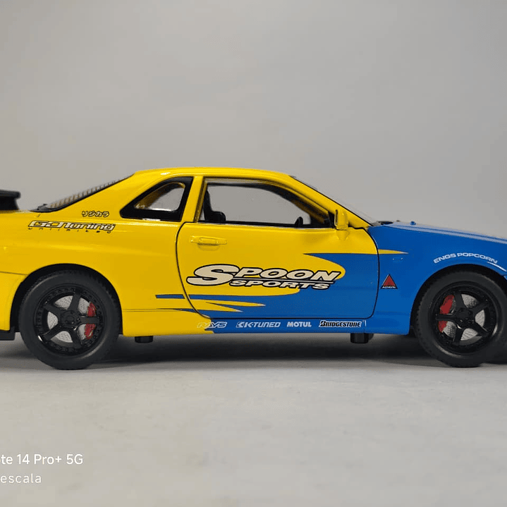 Nissan Skyline Gtr  ESCALA 1:24 MARCA JINLIFANG, AMARILLO  11