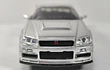 NISSAN SKYLINE GT R 34 PLATEADO , ESCALA 1/32, MARCA JADA