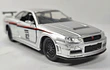 NISSAN SKYLINE GT R 34 PLATEADO , ESCALA 1/32, MARCA JADA