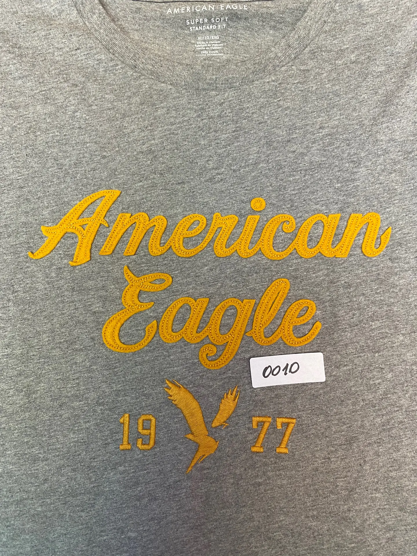Polera Hombre American Eagle Gris Jaspeada con Estampado Talla XL 9