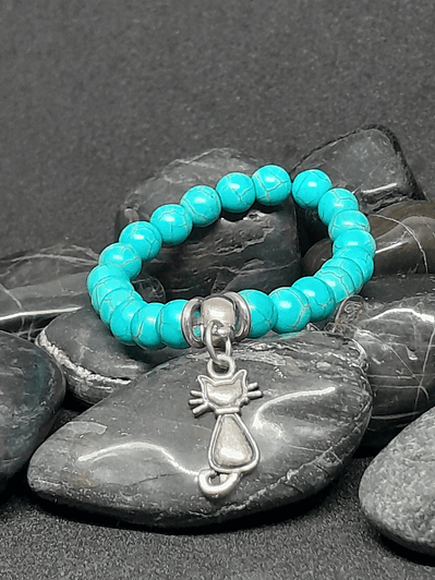 Pulsera piedras turquesa dije gato.