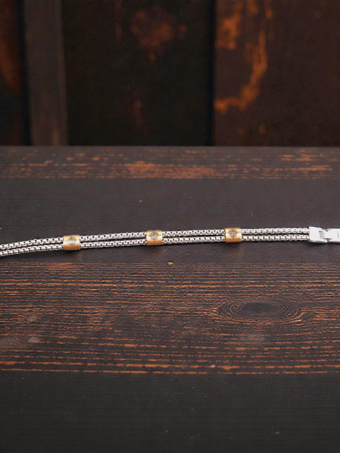 Pulsera de acero con detalles color cobrizo 21cm 2