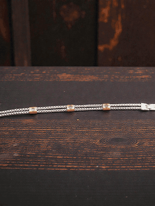 Pulsera de acero con detalles color cobrizo 21cm