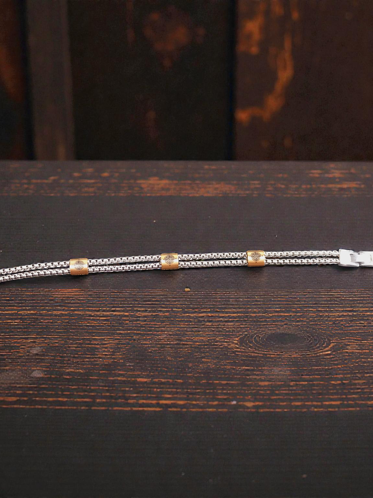 Pulsera de acero con detalles color cobrizo 21cm 2