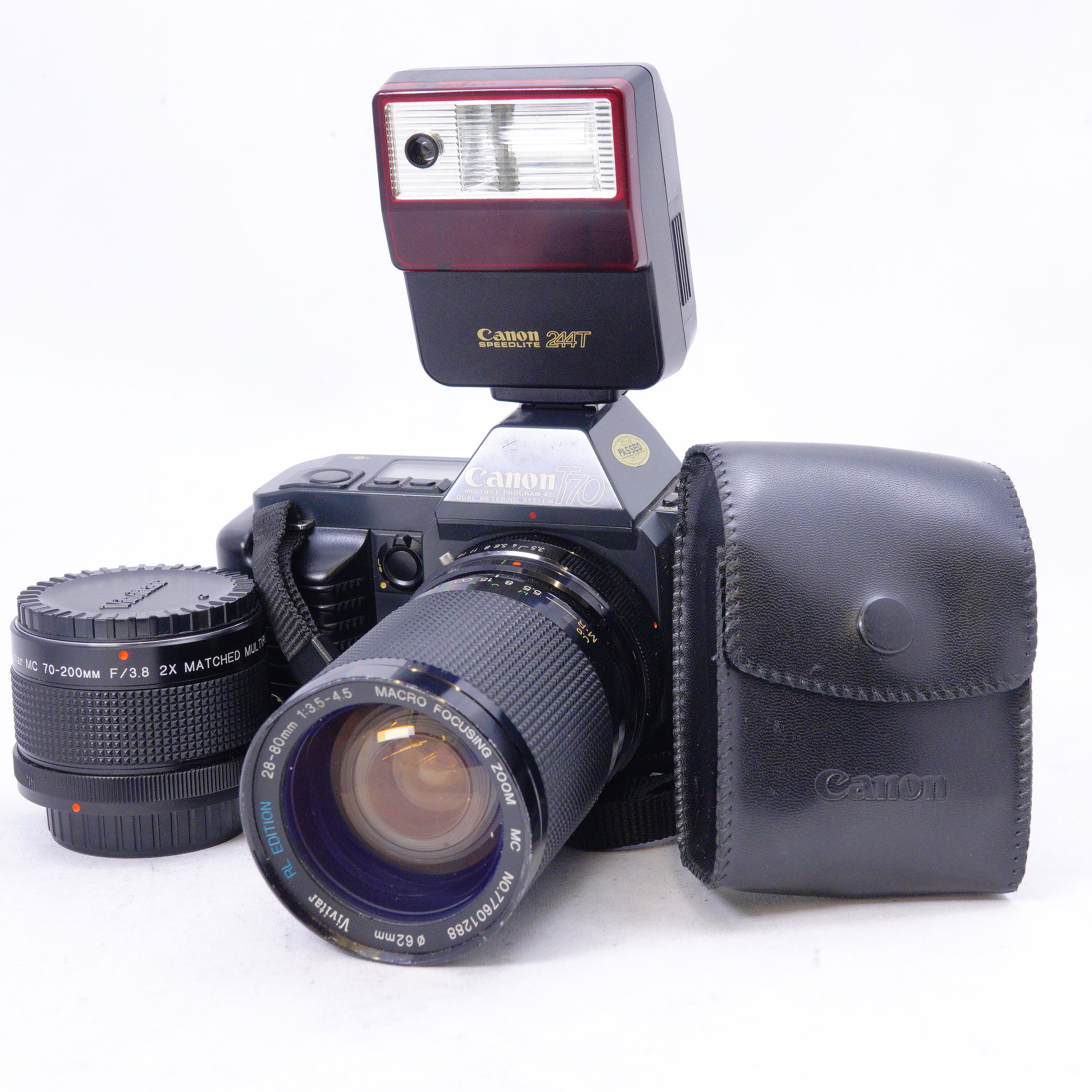 Canon T70 SLR con lente Vivitar 28-80mm mas accesorios - Usado