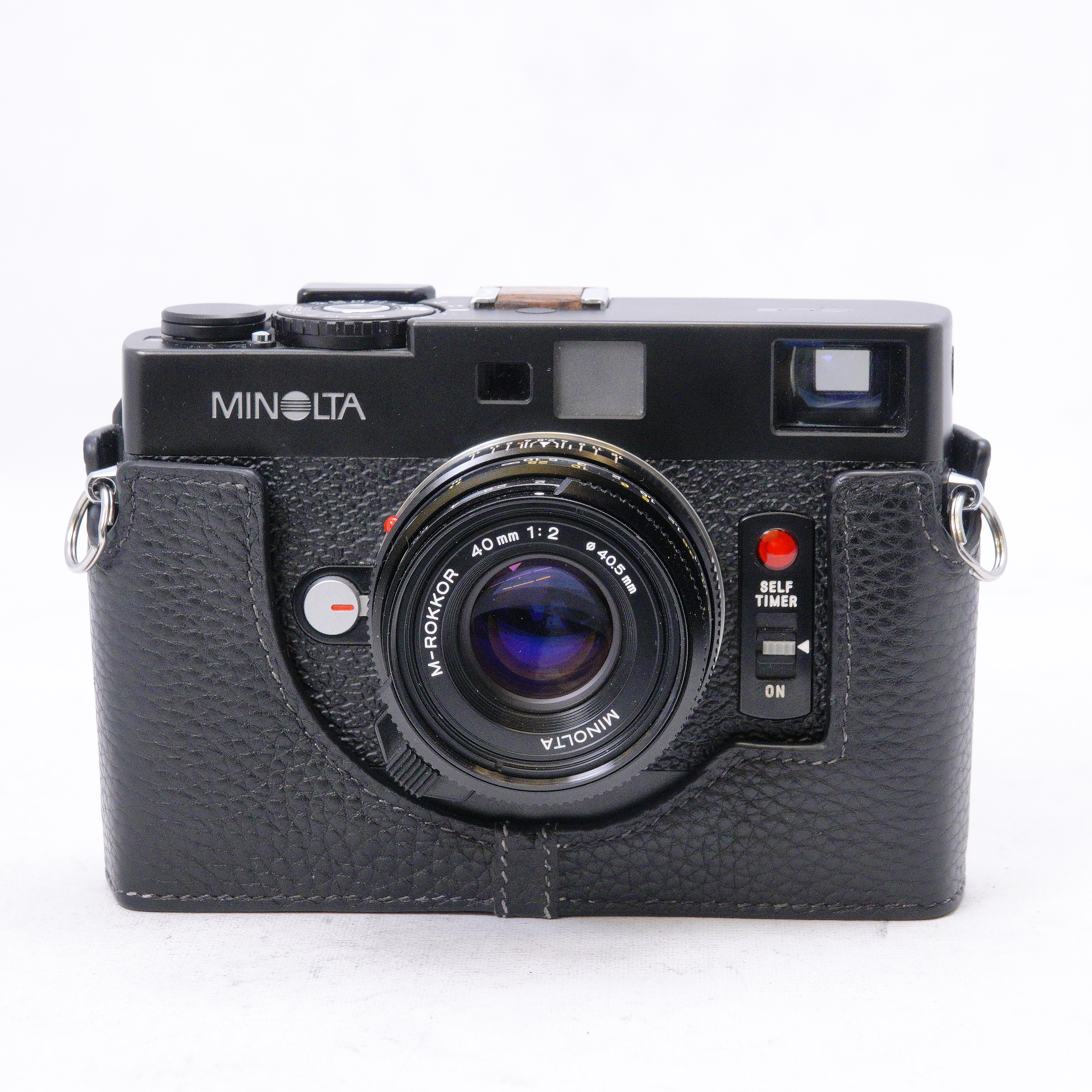 Minolta CLE con lente M-Rokkor 40mm F2 y Half Case de transp