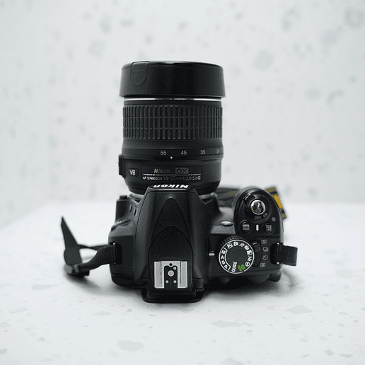 Nikon D3100 con lente 18-55mm y grip - Usado 4