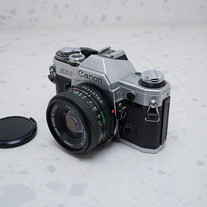 Canon AE-1 + Canon FD 50mm f/1.8 - USADO 