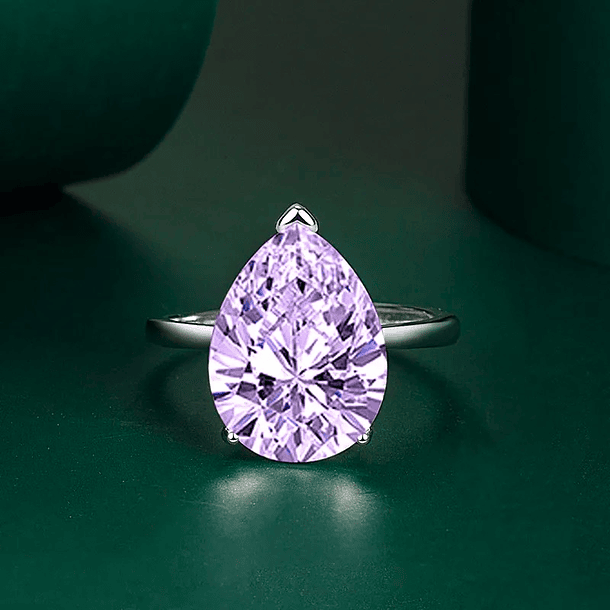 Anillo solitario en oro blanco de 14k con Topacio London Blue. Talla 7  