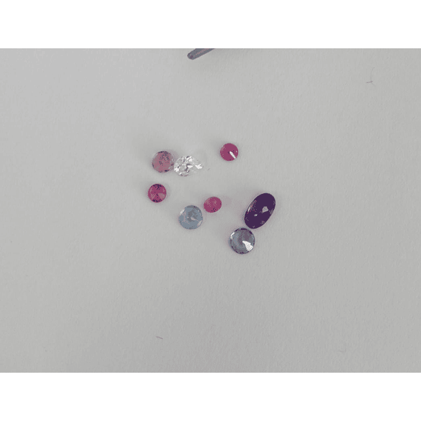 Lote que incluye- 3 Rubíes c/redondos, 1 Aguamarina c/redondo, 1 Tanzanita c/redondo, 1 Amatista c/oval, 1 Turmalina c/redondo, 1 Moissanita c/pera 