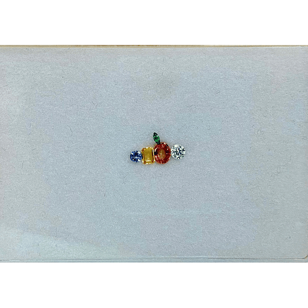 Set que incluye: Moissanita c/redondo-Zafiro naranja c/oval-Zafiro amarillo c/octágono-Tanzanita c/redondo 