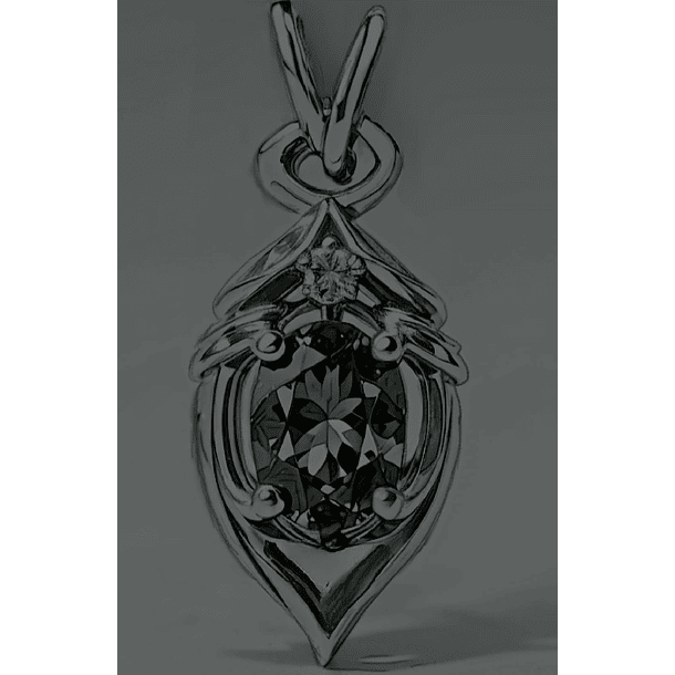 Dije en plata ley 925 con baño de rodio y moissanita oval de 7x5mm y redonda de 2.5mm. 