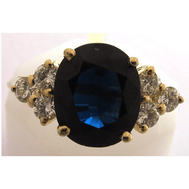 Anillo en oro blanco de 14k con topacio london blue corte oval de 10x7.8x5mm y 6 moissanitas de 2.5mm talla 7} 