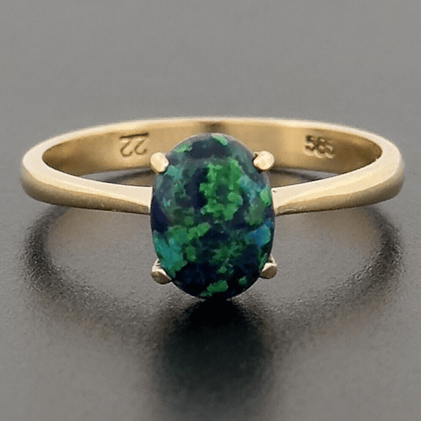 Anillo en plata ley 925 con ópalo azul corte cabujón ovalado de 14x10.1mm talla 11 